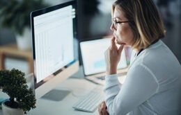 Woman working on a desktop computer