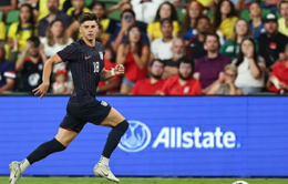 Max Arfsten of the United States drives a ball