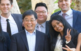 Yunzeng Wang, dean of the UC Riverside School of Business (front row, center), poses with MBA students on campus. (Credit: UC Riverside)