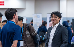 An alumnus chats with potential employers