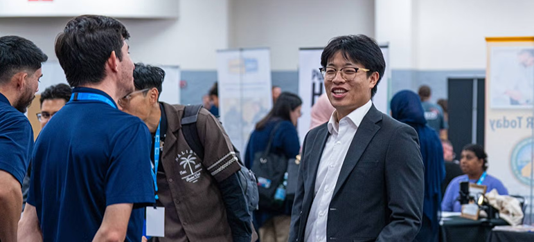 An alumnus chats with potential employers