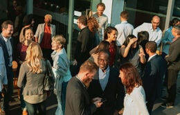 Diverse group socializing outdoors photo