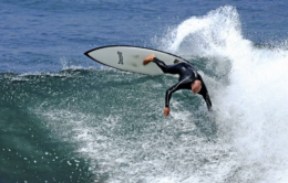 Tyler surfing in San Diego