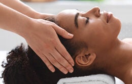 Young african american woman getting head massage
