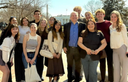 Small group of people with the White House in the background